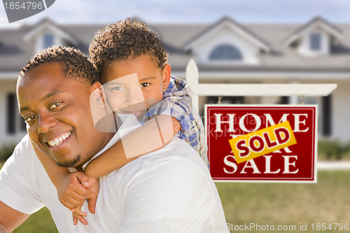 Image of Mixed Race Father and Son In Front of Real Estate Sign and House