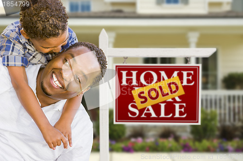 Image of Mixed Race Father and Son In Front of Real Estate Sign and House