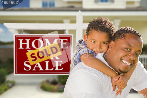 Image of Mixed Race Father and Son In Front of Real Estate Sign and House