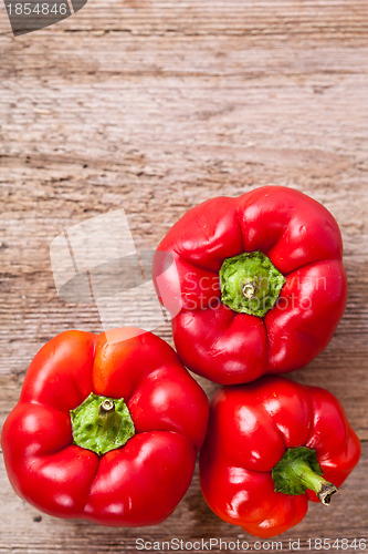 Image of peppers on rustic wooden table