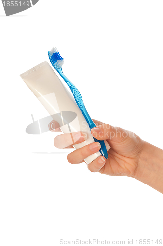 Image of Toothpaste and blue toothbrush