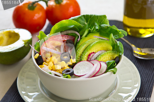 Image of Avocado with sweet corn and olive salad