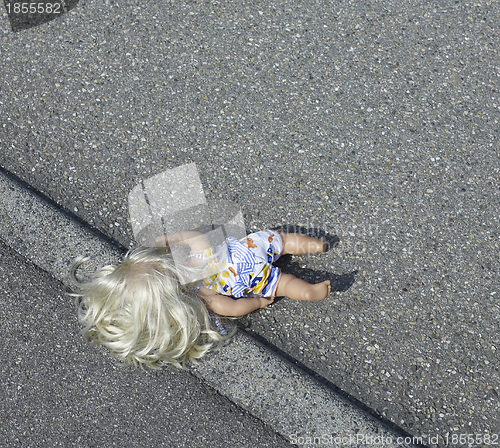 Image of doll on the street