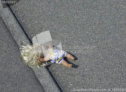 Image of doll on the street