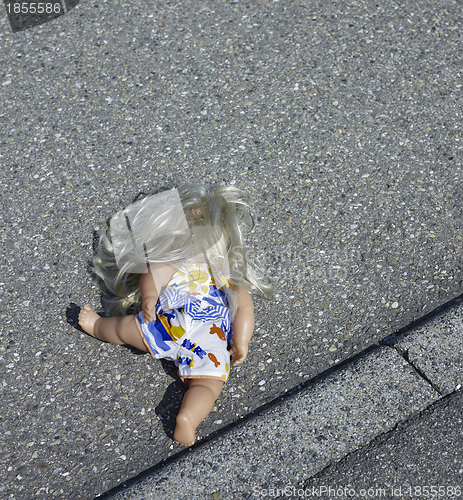 Image of doll on the street