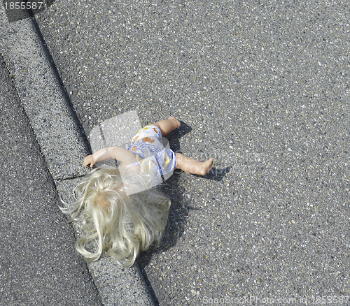 Image of doll on the street