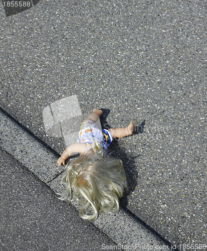 Image of doll on the street