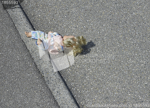 Image of doll on the street