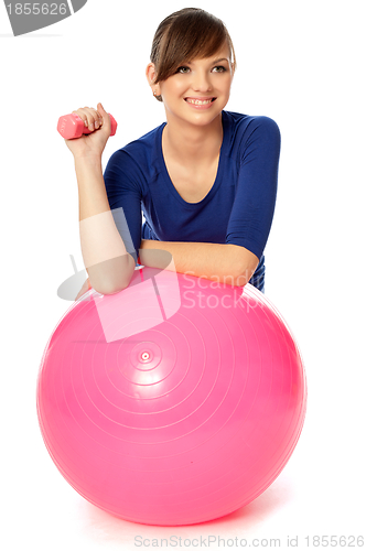 Image of Exercises with dumbbells on a gymnastic ball