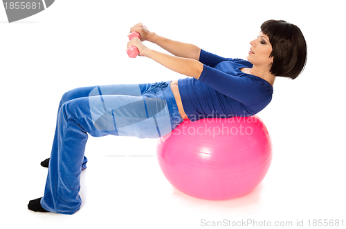 Image of Exercises with dumbbells on a gymnastic ball