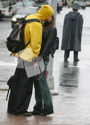 Image of Kissing couple after the rain