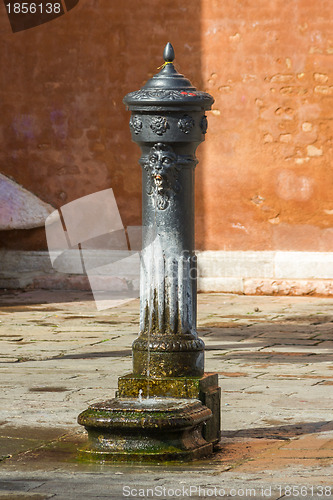 Image of ancient drinking spring on the square