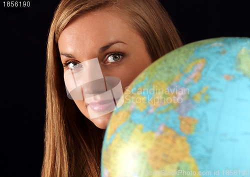 Image of Woman behind globe