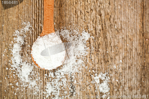 Image of cooking salt in wooden spoon