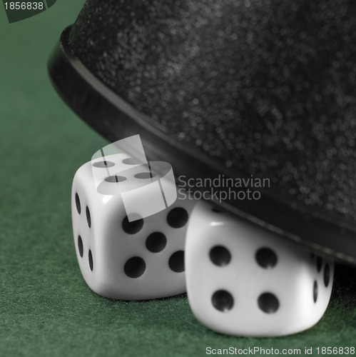 Image of gambling tension with hidden dice