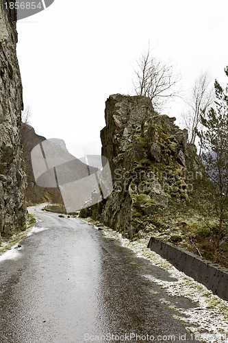 Image of run-down road in rural landscape