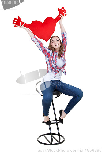 Image of Beautiful girl with A red plush heart