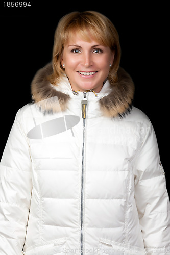 Image of portrait of a beautiful girl in a winter jacket
