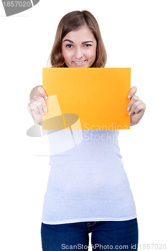 Image of Beautiful girl with a yellow sheet of paper winks