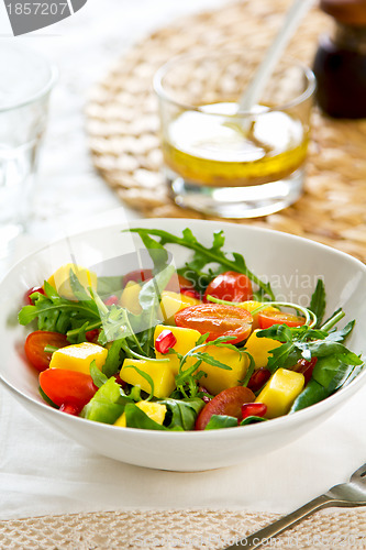 Image of Mango with Pomegranate and rocket salad