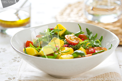 Image of Mango with Pomegranate and rocket salad