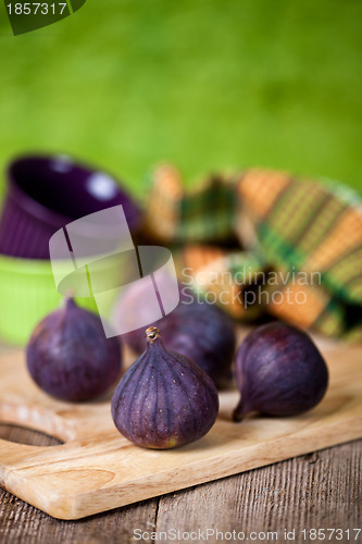 Image of  fresh figs on rustic wooden table