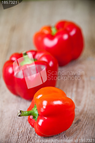 Image of three red bell peppers