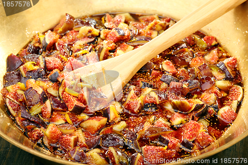 Image of Fig slices with syrup closeup.