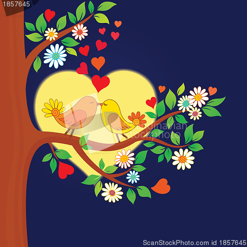 Image of Two kissing birds on the tree