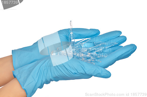 Image of assistant taking ampules for making a test