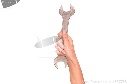 Image of spanner in the woman's hand