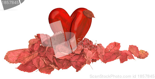 Image of heart in the pile of autumn red leaves