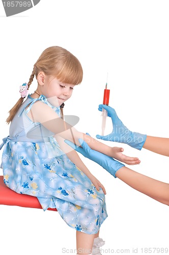 Image of doctor taking a blood from a child