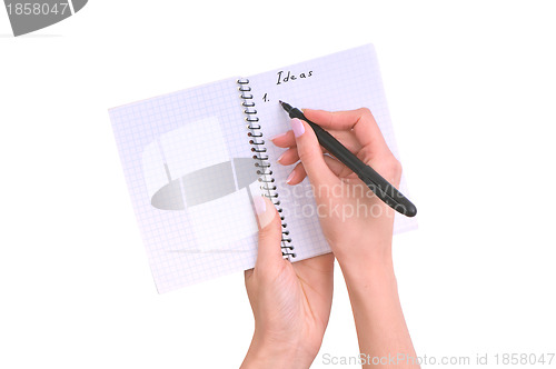 Image of business woman writes ideas for business plan