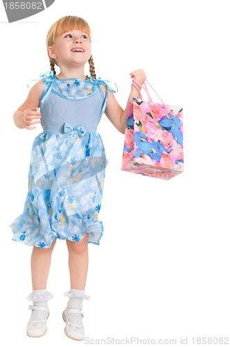 Image of little girl making purchases in the shop