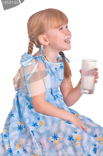 Image of laughing girl drinking a glass of milk
