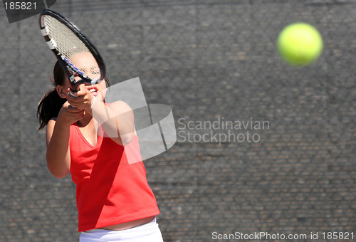 Image of Young girl playing tennis