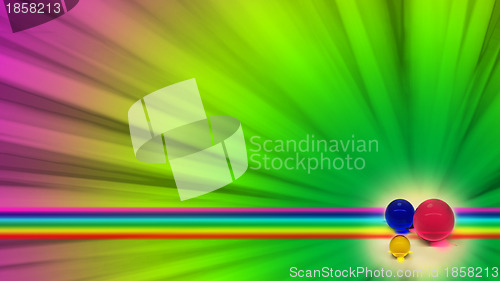 Image of three colored balls on the rainbow background