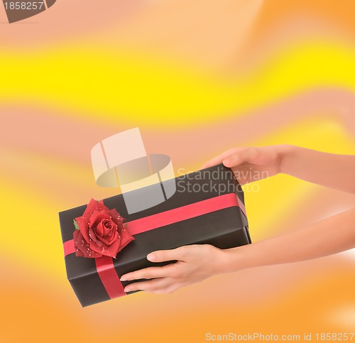 Image of gift with red rose