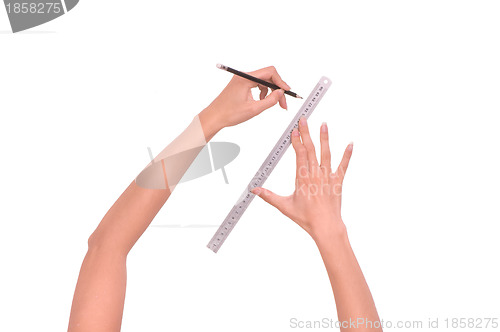Image of woman draws line with rule and pencil