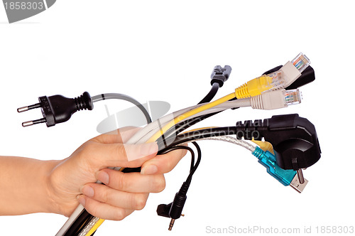 Image of woman taking different cables in the hand