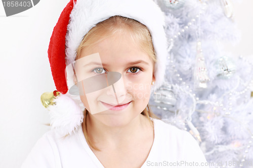 Image of Lovely girl with Santa hat