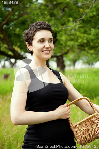 Image of woman with basket in the garden 