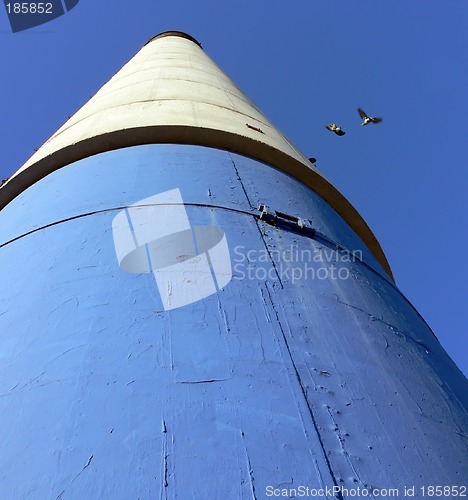 Image of Blue, White and Black Chimney with Pigeons