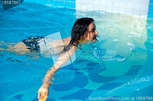 Image of Attractive girl in swimming pool