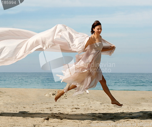 Image of Happy woman on the beach