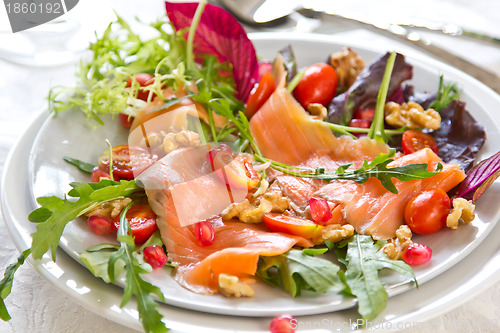 Image of Smoked salmon with pomegranate and walnut salad