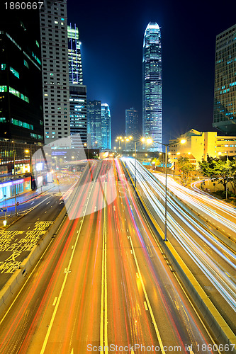 Image of traffic light through city