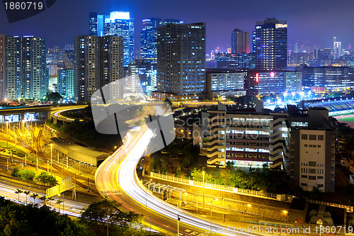 Image of highway and traffic in city at night