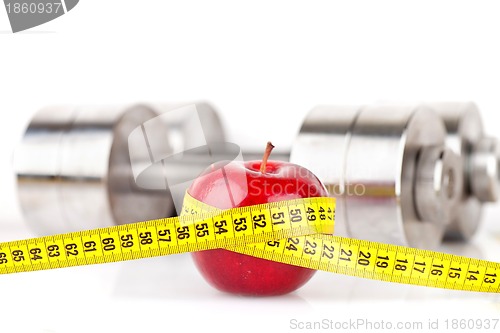 Image of Dumbbells with an apple